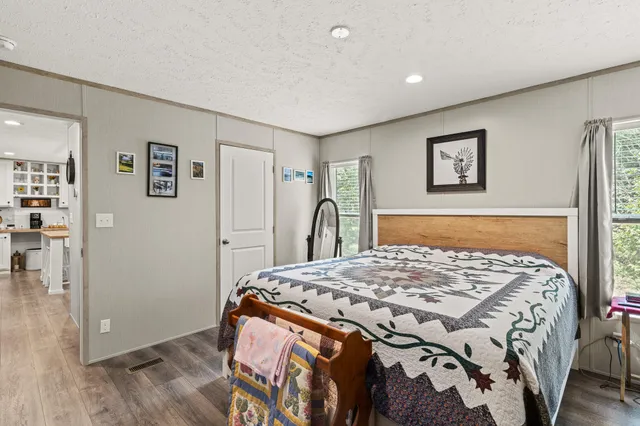 a bedroom with a bed and a cabinets