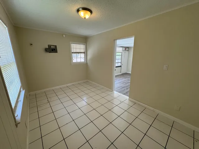 a view of an empty room and window