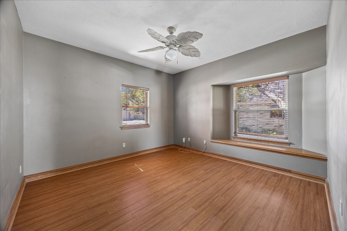 1835 Raintree Circle Seabrook, TX 77586 - Photo 15 of 50 a view of an empty room with wooden floor and a window