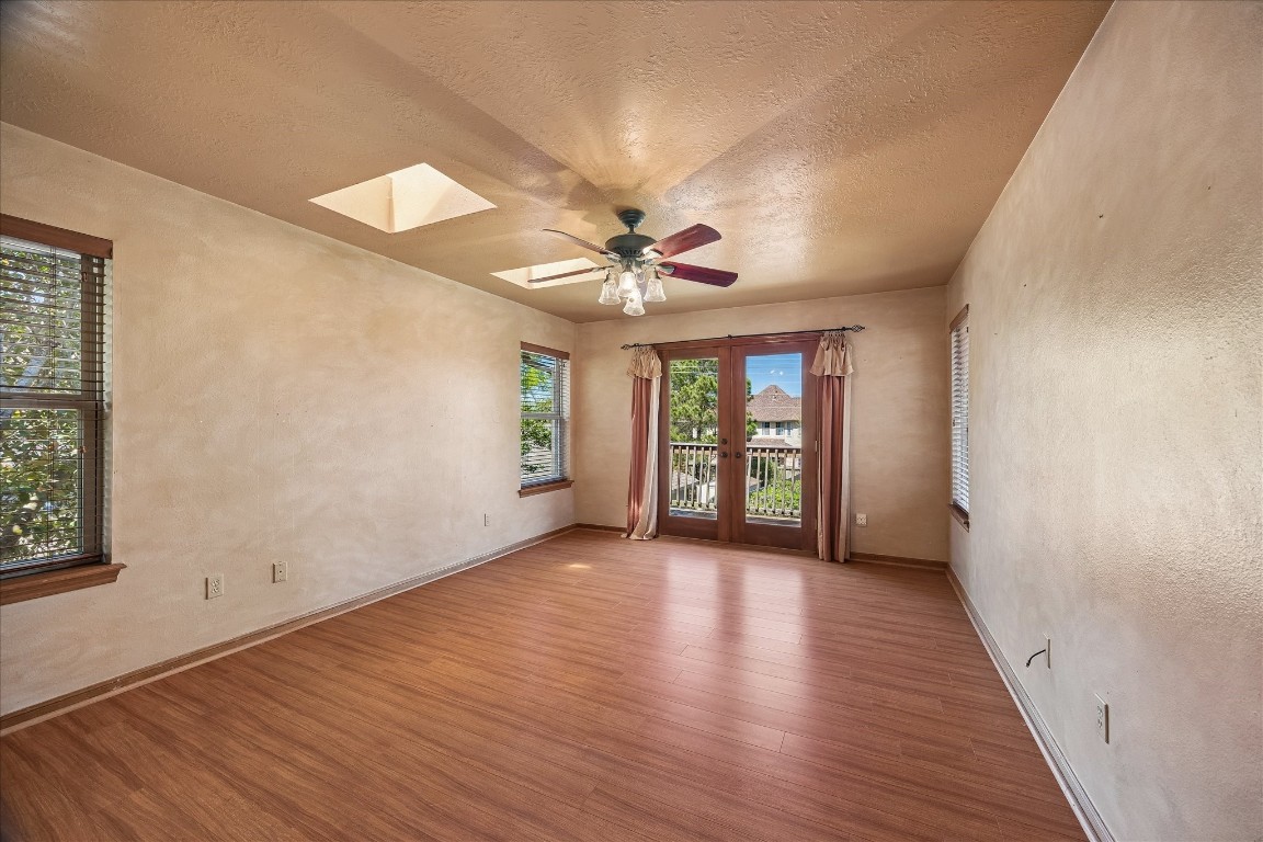 1835 Raintree Circle Seabrook, TX 77586 - Photo 17 of 50 a view of an empty room with a window and wooden floor