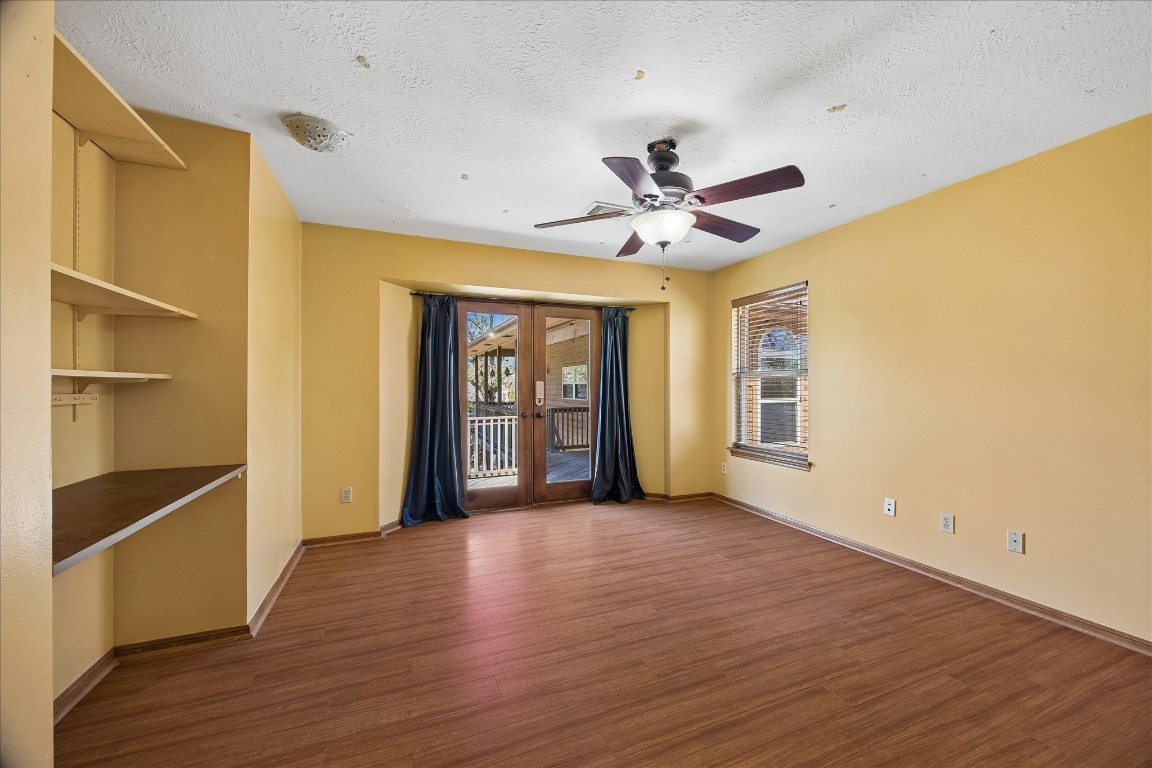 1835 Raintree Circle Seabrook, TX 77586 - Photo 23 of 50 a view of an empty room with a window and wooden floor