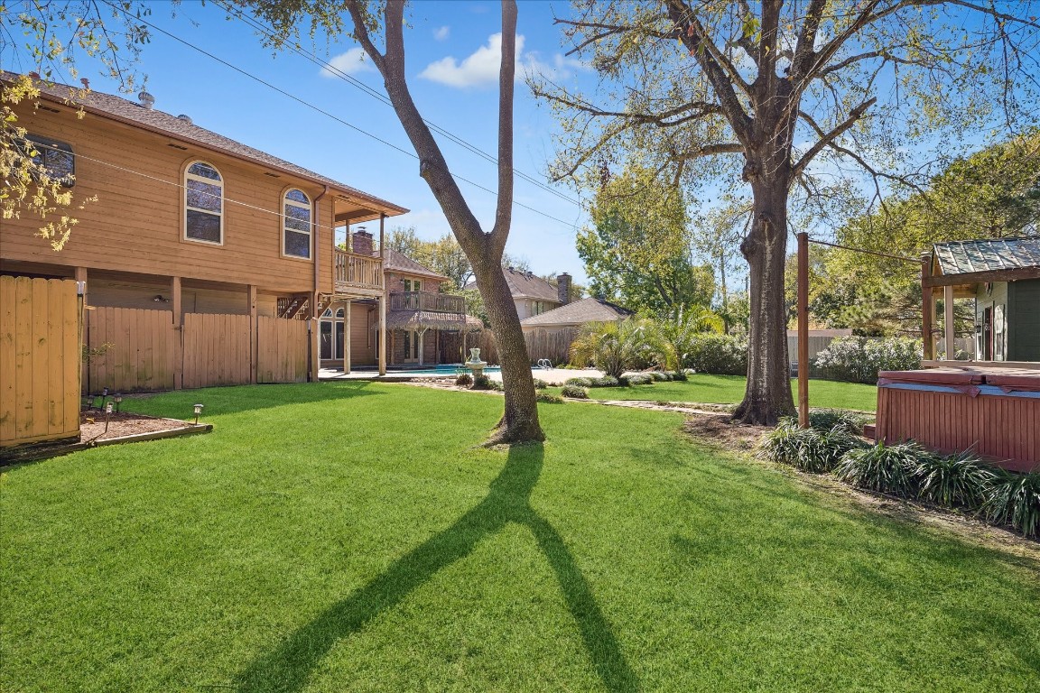 1835 Raintree Circle Seabrook, TX 77586 - Photo 40 of 50 a view of a house with a back yard