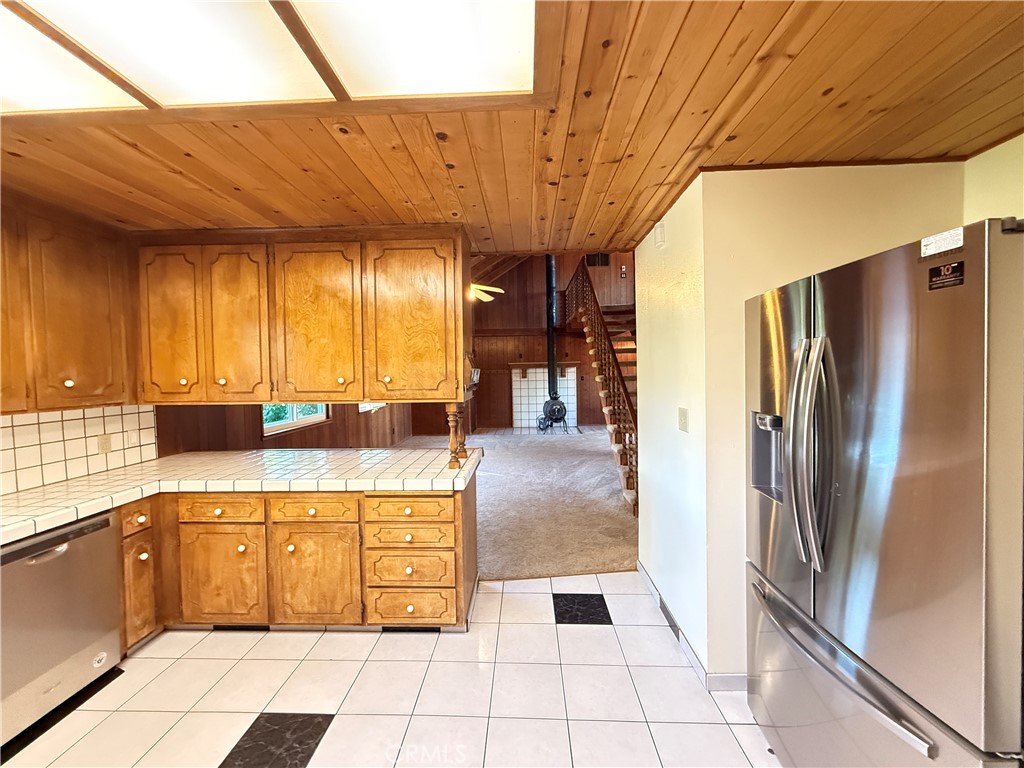 5452 Carleton Road Mariposa, CA 95338 - Photo 30 of 57 a kitchen with stainless steel appliances granite countertop a refrigerator a sink and dishwasher