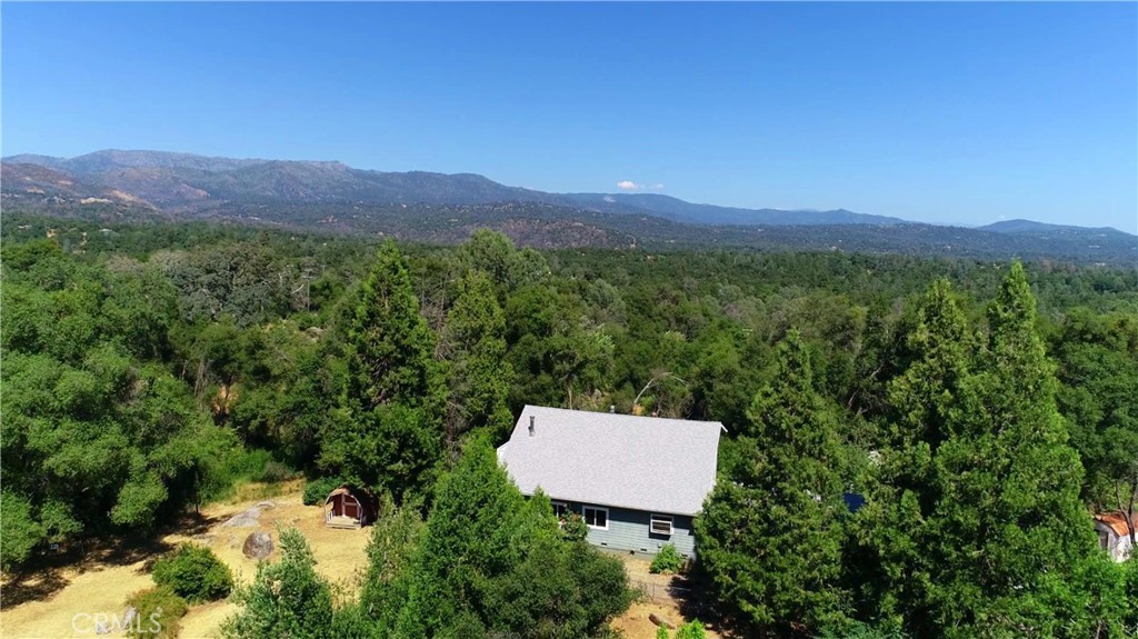 5452 Carleton Road Mariposa, CA 95338 - Photo 3 of 57 a view of a lush green field and a mountain