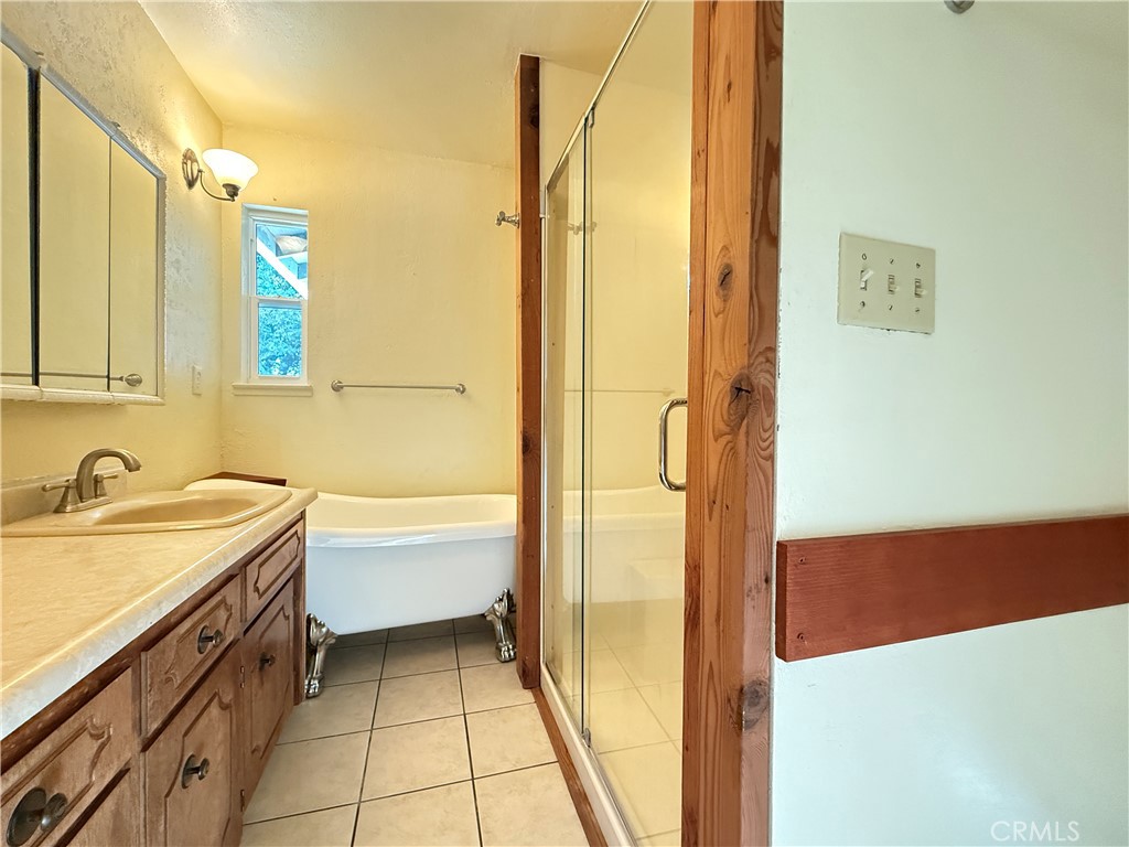 5452 Carleton Road Mariposa, CA 95338 - Photo 49 of 57 a bathroom with a tub sink and mirror