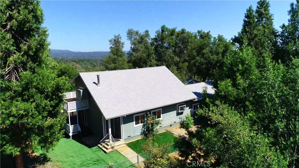 5452 Carleton Road Mariposa, CA 95338 - Photo 56 of 57 an aerial view of a house with yard and trees in the background