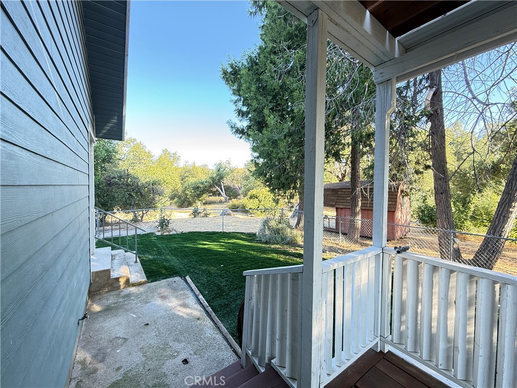 5452 Carleton Road Mariposa, CA 95338 - Photo 8 of 57 a view of a porch with wooden floor and fence