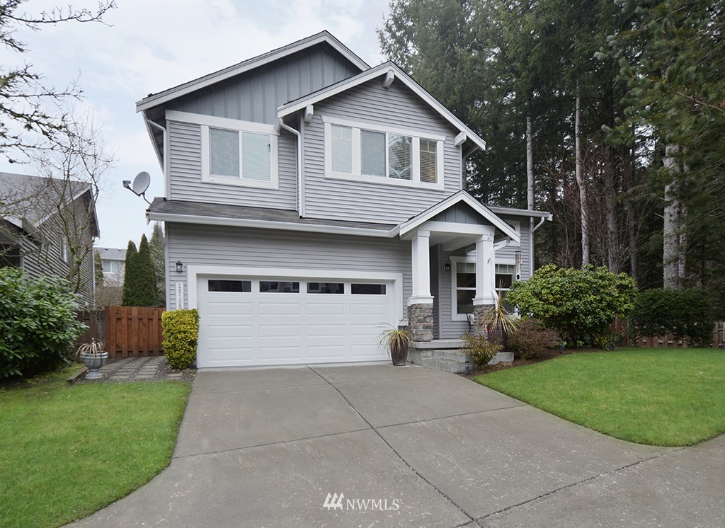 28108 Maple Ridge Way Southeast Maple Valley, WA 98038 - Photo 1 of 35 a front view of house with yard and green space