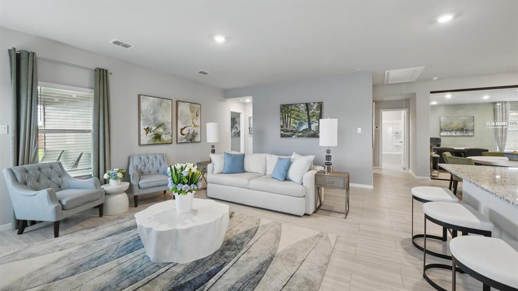 1645 Tin Roof Road Krum, TX 76249 - Photo 9 of 36 a living room with furniture and a large window