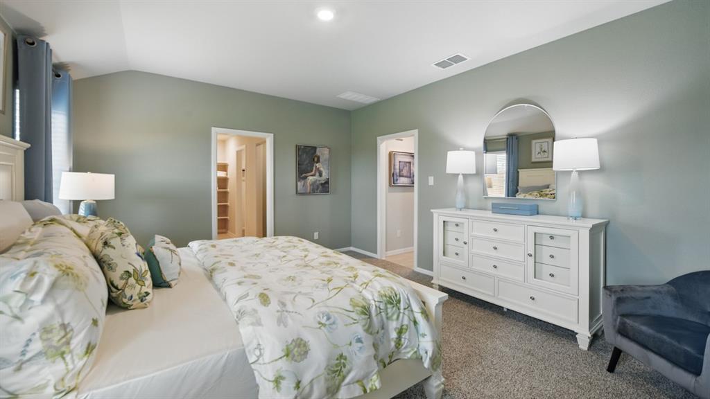 1645 Tin Roof Road Krum, TX 76249 - Photo 15 of 36 a bedroom with a bed and a dresser