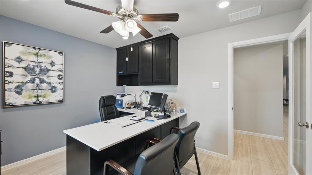1645 Tin Roof Road Krum, TX 76249 - Photo 21 of 36 a view of a dining room with furniture and wooden floor