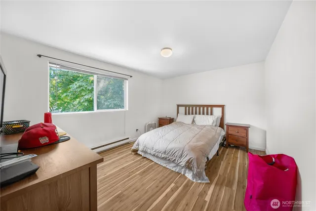 a bedroom with a bed and window