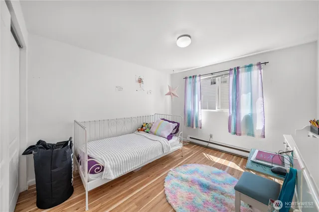 a bedroom with a bed and a chair