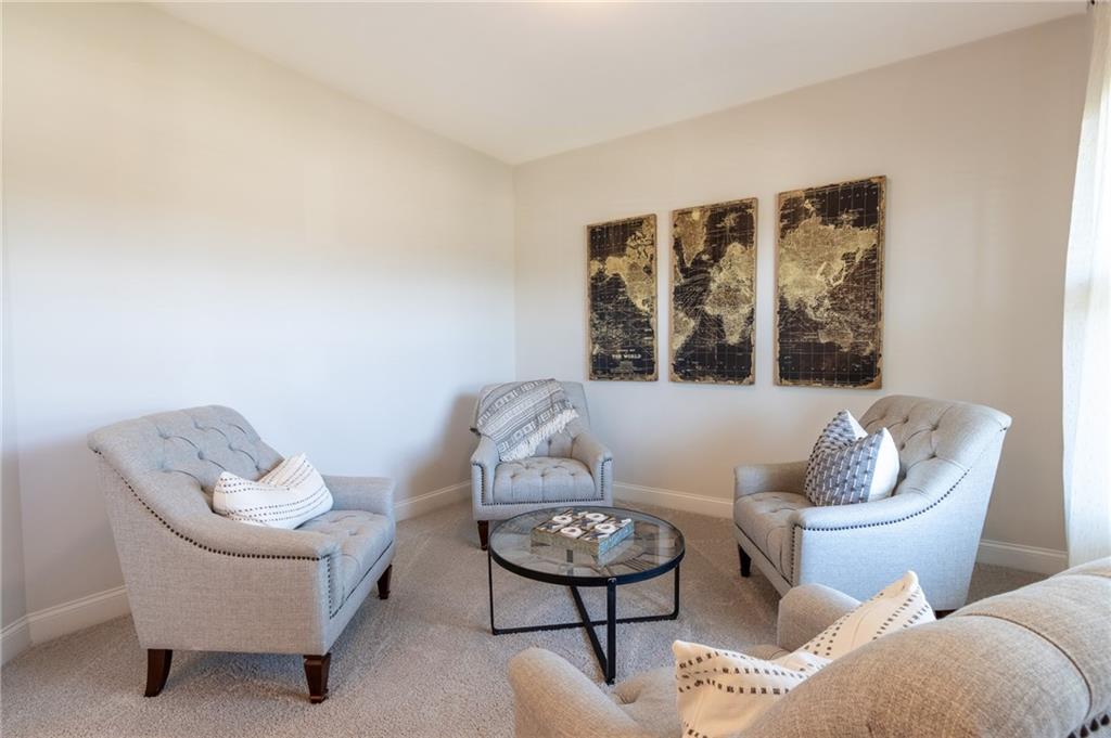 560 Calgary Downs Drive Winder, GA 30680 - Photo 11 of 37 a living room with furniture and a window