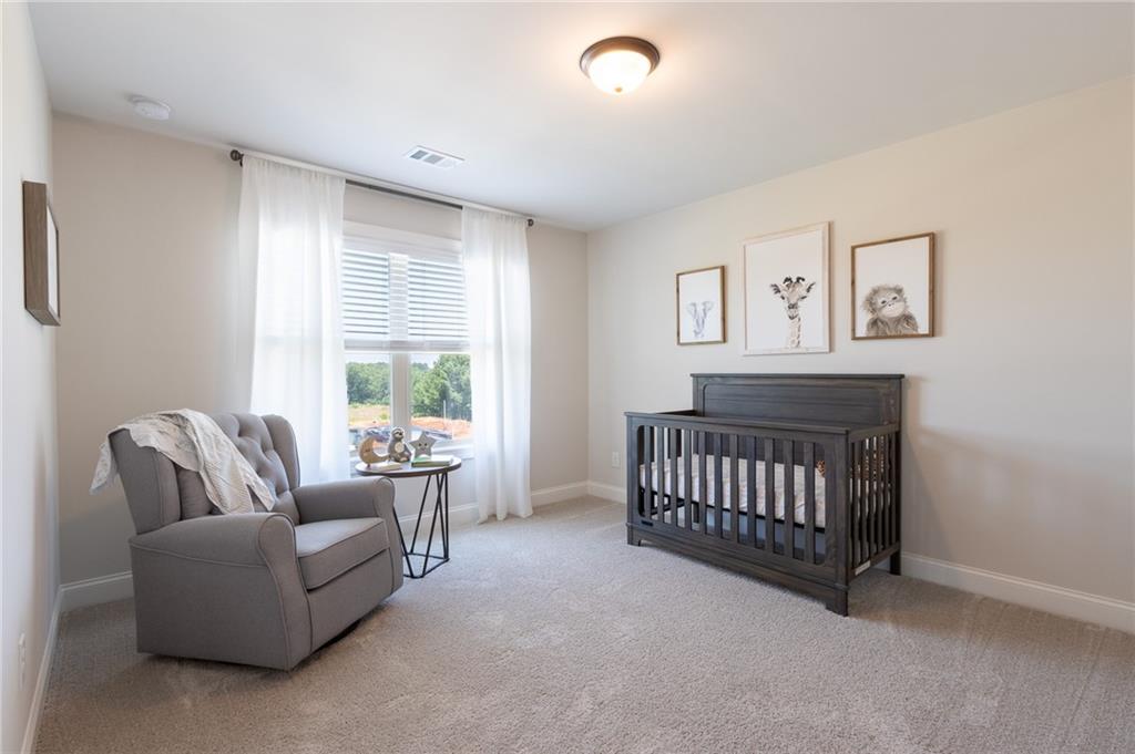560 Calgary Downs Drive Winder, GA 30680 - Photo 32 of 37 a living room with furniture and a window