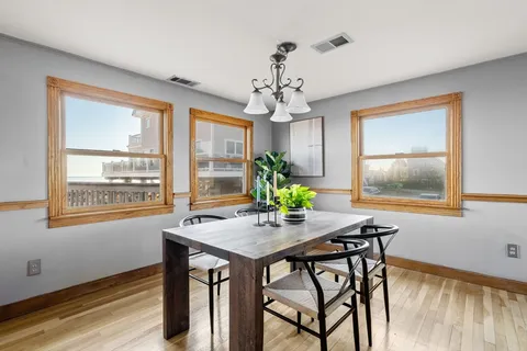 a kitchen with a table and chairs in it