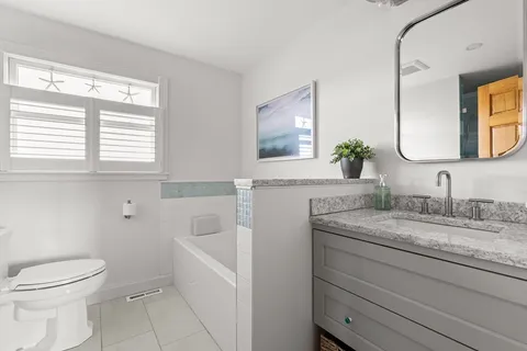 a bathroom with a shower and a toilet
