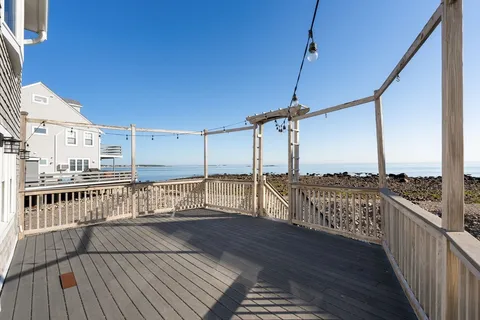 a view of a balcony with an ocean view