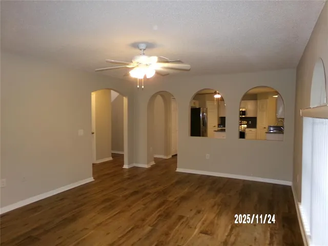 a view of a room with wooden floor