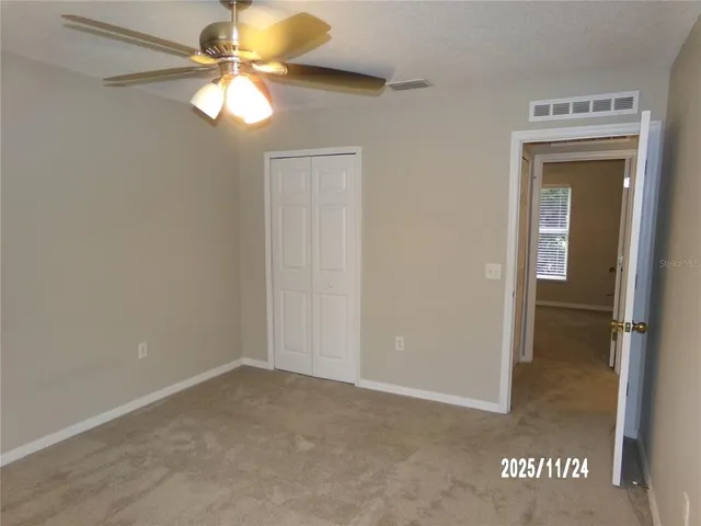 a view of a chandelier fan in a room
