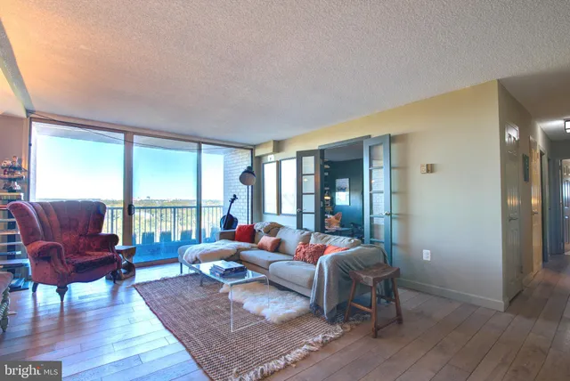 a living room with furniture and a large window