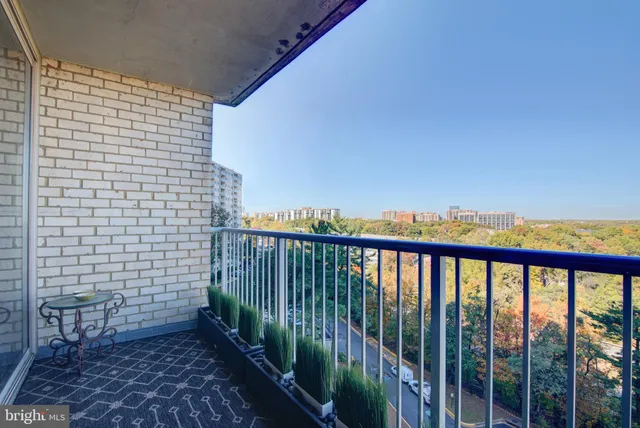 a view of a balcony with a trees