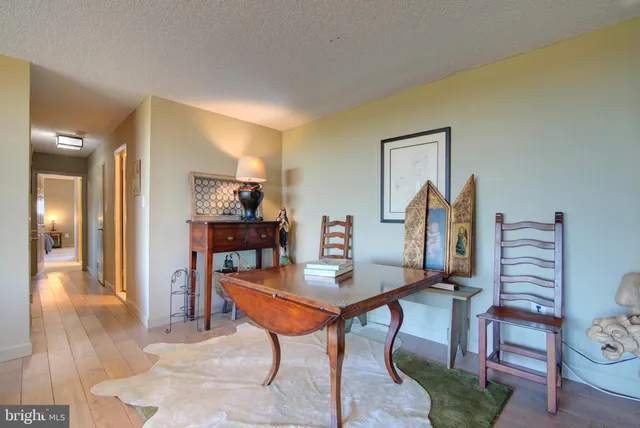 a view of a livingroom with furniture and a wooden floor