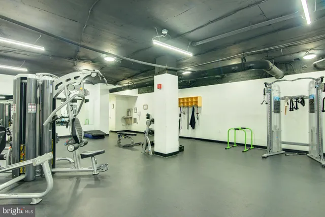 a living room with furniture and chandelier