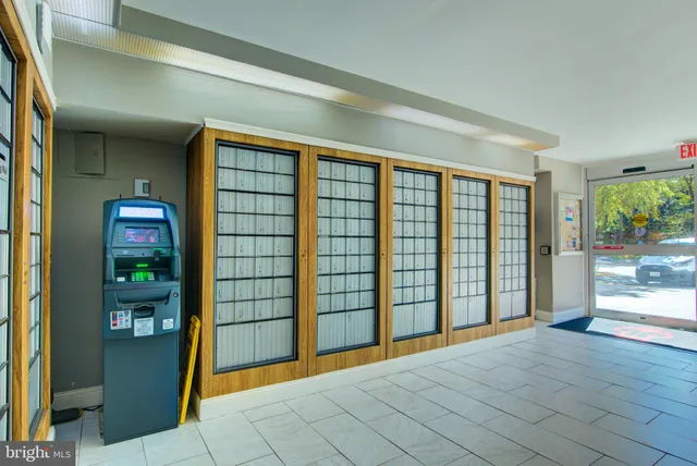 a large kitchen with a table and chairs in it