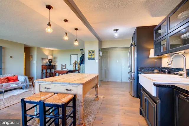 a large kitchen with a table and chairs