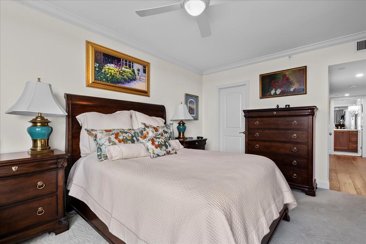 3322 Casseekey Island Road, Unit 901 Jupiter, FL 33477 - Photo 21 of 68 a bedroom with bed and a flat screen tv