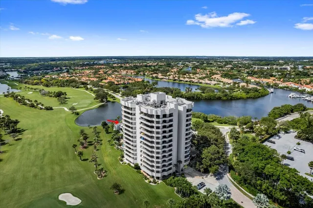 an aerial view of a residential houses with city view