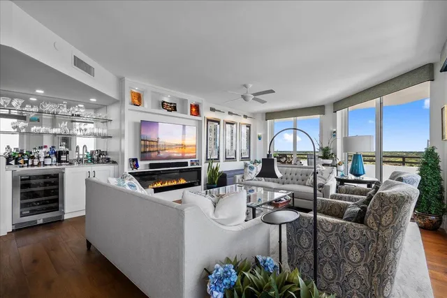 a kitchen with stainless steel appliances a dining table and chairs