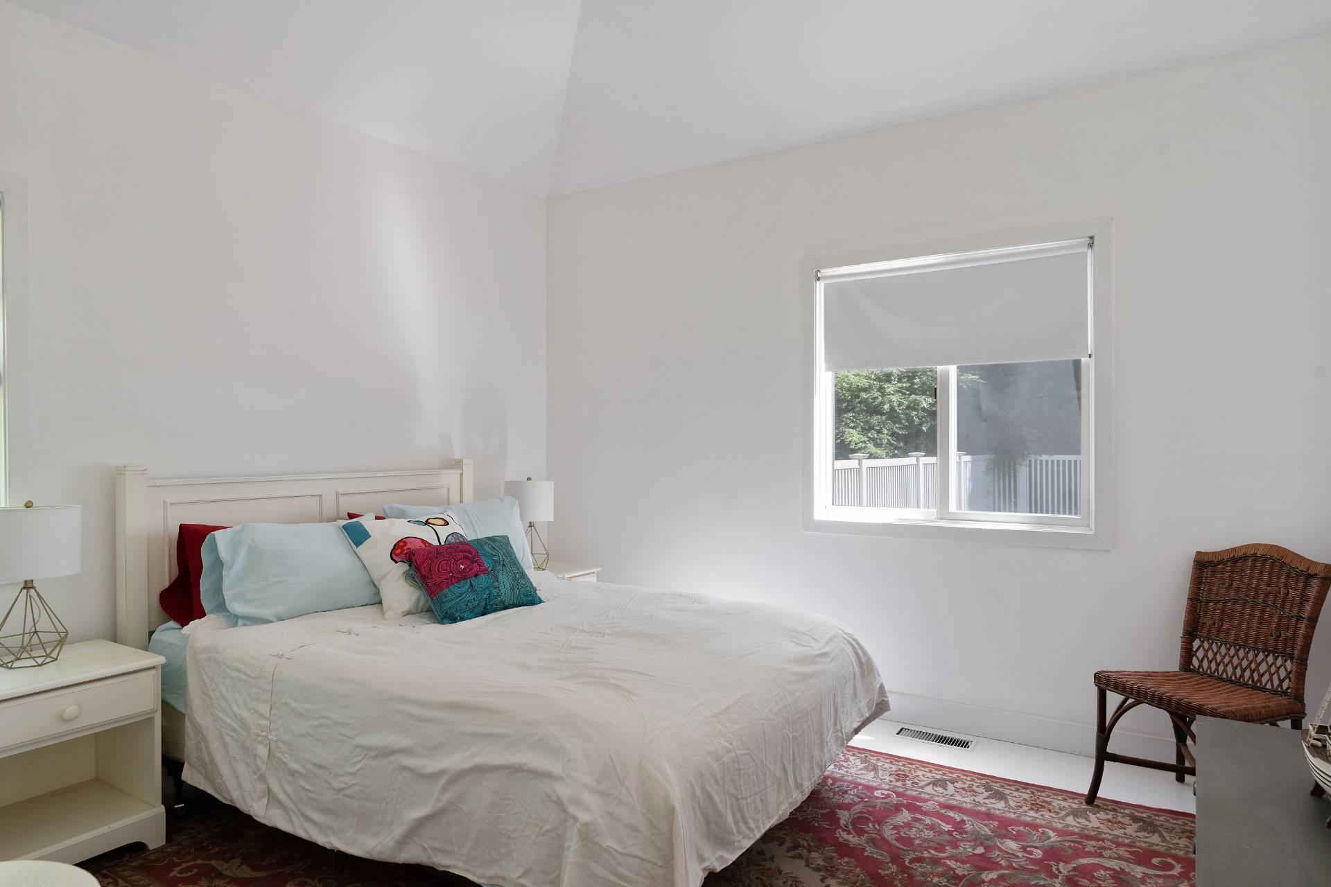 11 Wagon Lane East Hampton, NY 11937 - Photo 13 of 17 a bedroom with a bed and a window