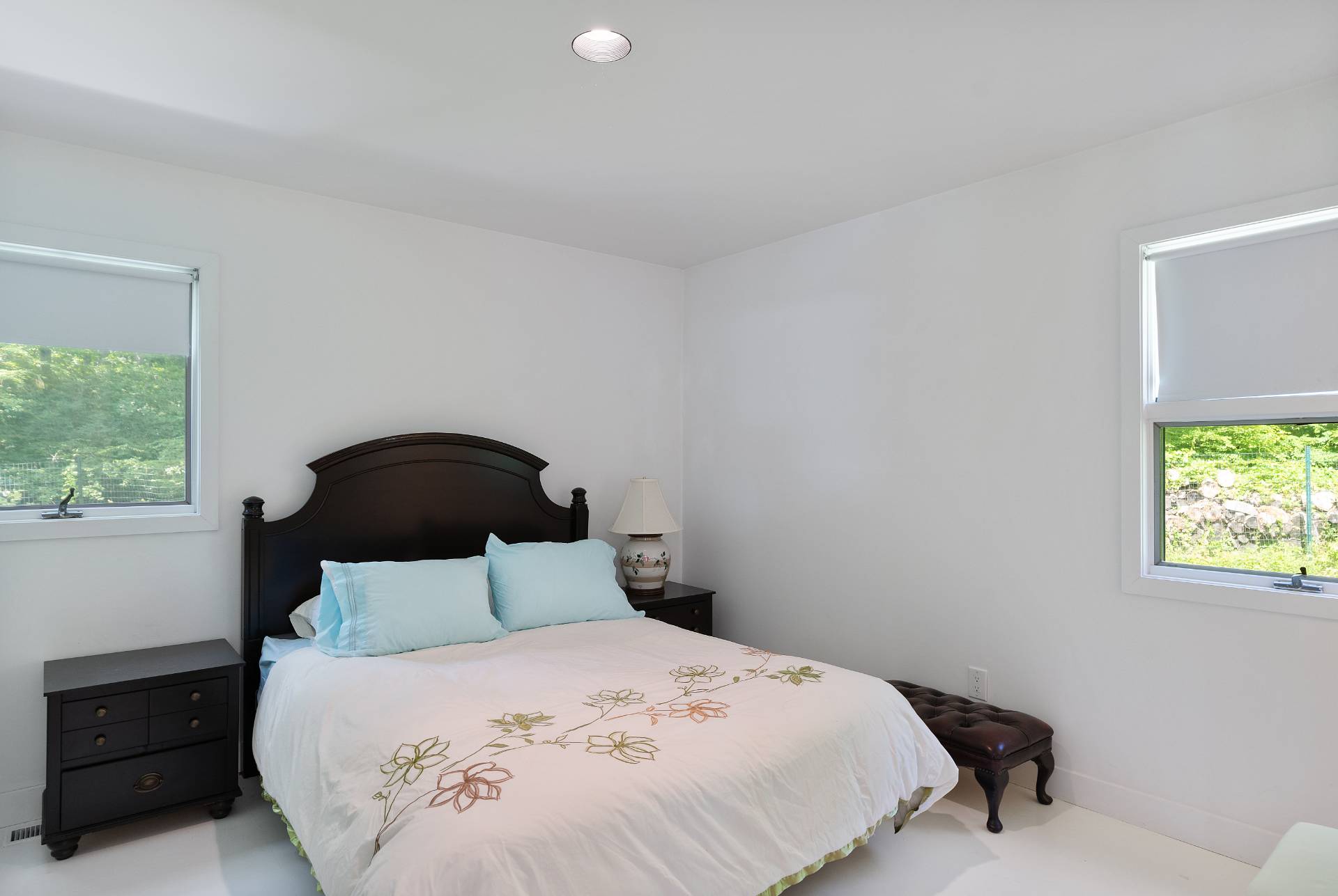 11 Wagon Lane East Hampton, NY 11937 - Photo 14 of 17 a bedroom with a bed and a window