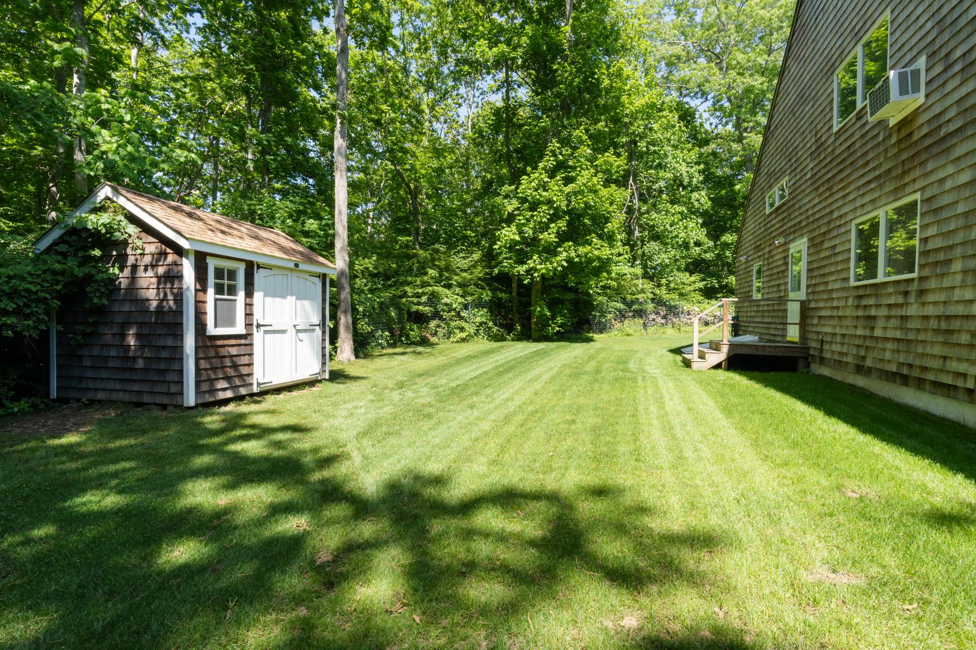 11 Wagon Lane East Hampton, NY 11937 - Photo 17 of 17 a view of a house with a backyard