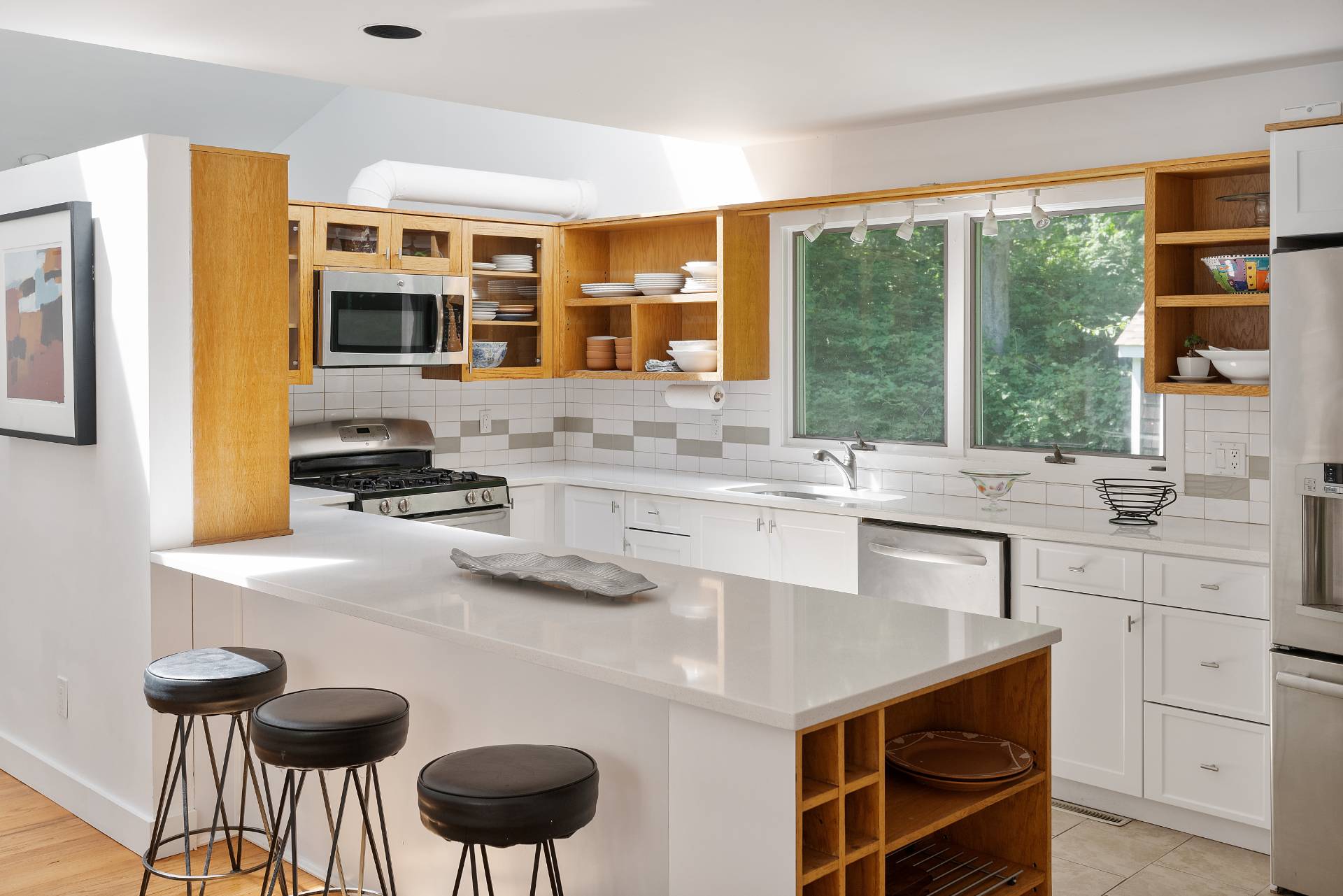 11 Wagon Lane East Hampton, NY 11937 - Photo 2 of 17 a kitchen with stainless steel appliances granite countertop a sink and a stove