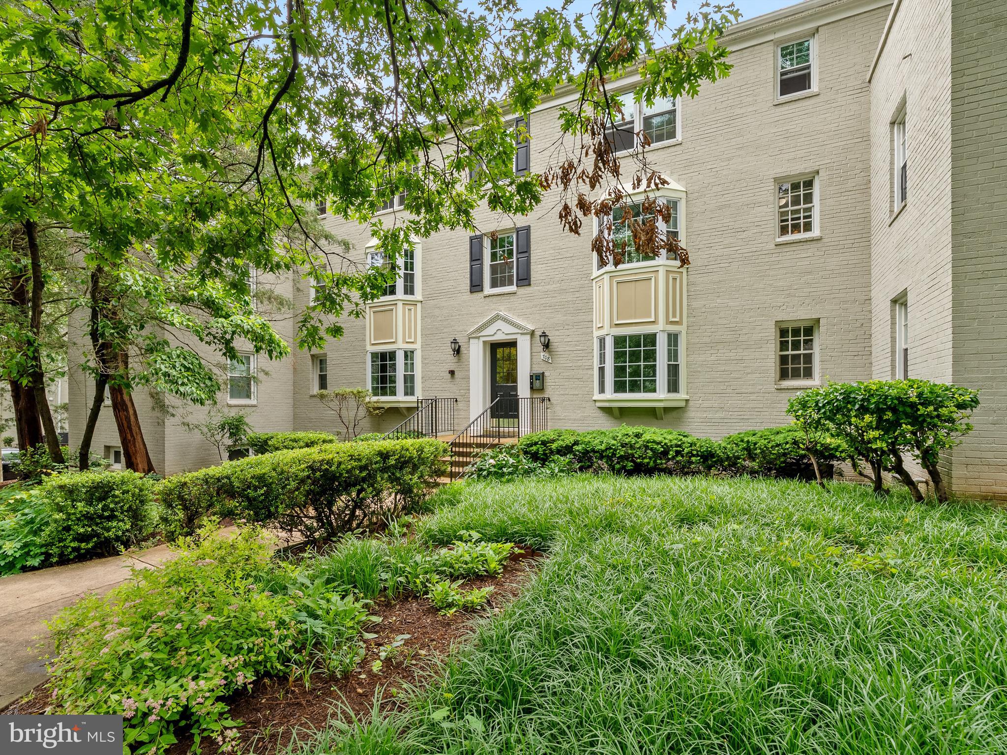 708 South Arlington Mill Drive, Unit 104 Arlington, VA 22204 - Photo 1 of 24 front view of a house with a garden
