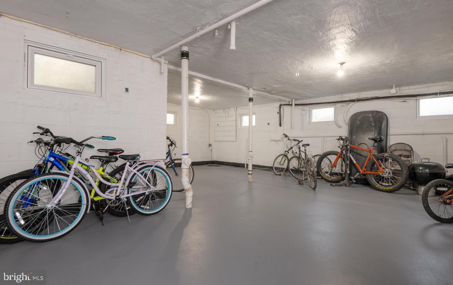 708 South Arlington Mill Drive, Unit 104 Arlington, VA 22204 - Photo 19 of 24 a view of a garage with a bike and car