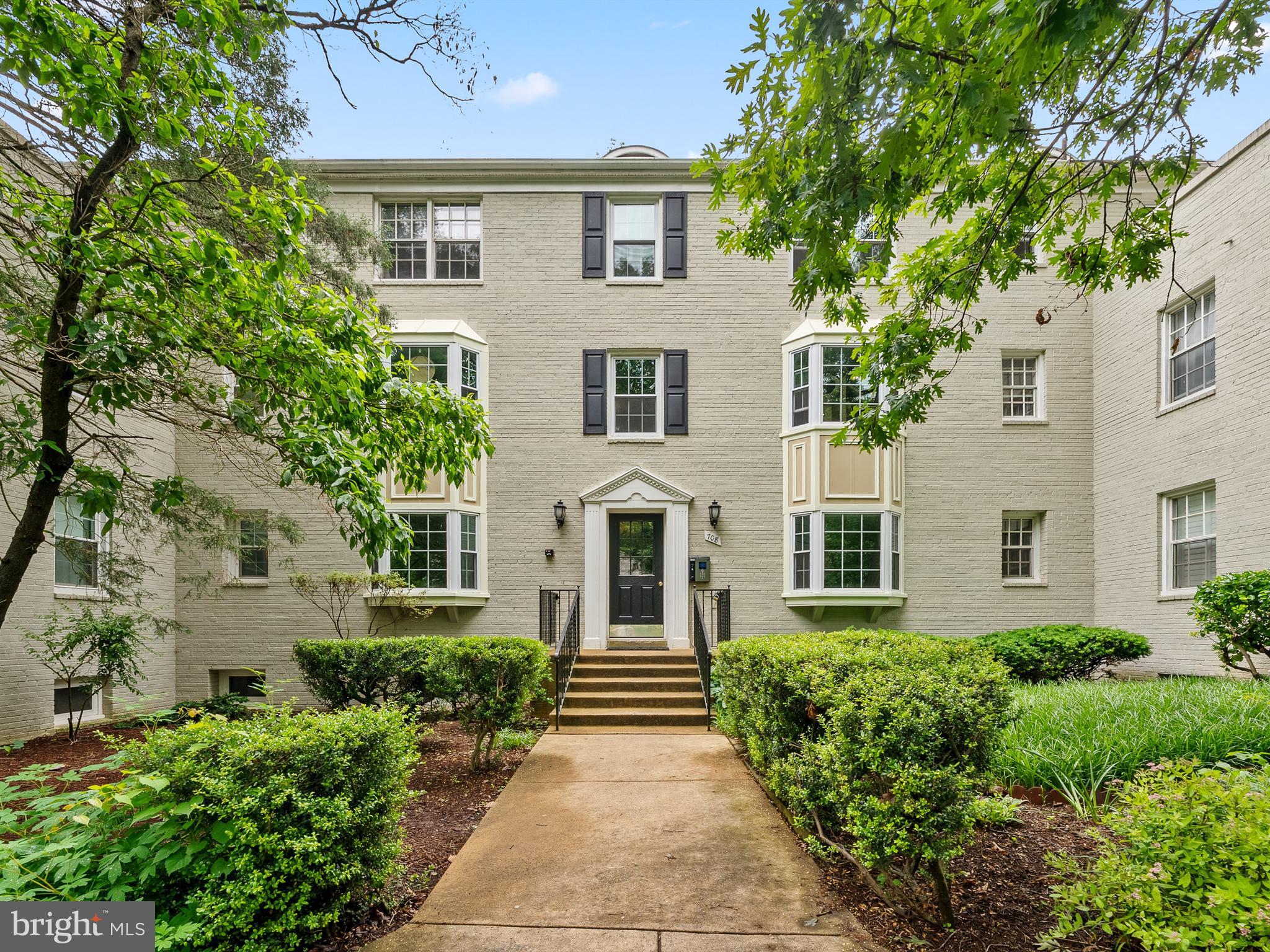 708 South Arlington Mill Drive, Unit 104 Arlington, VA 22204 - Photo 2 of 24 front view of a house with a yard