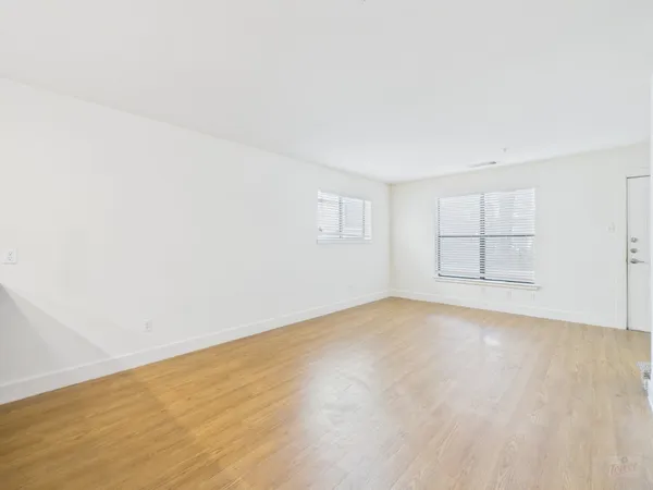 an empty room with a empty space and window