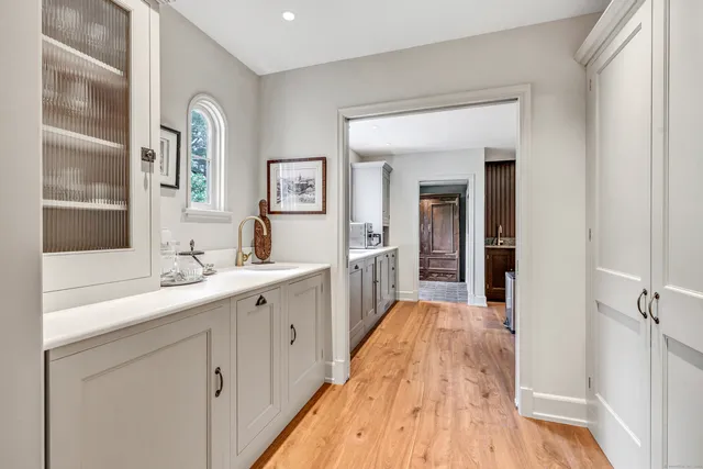 a spacious bathroom with a sink and a mirror