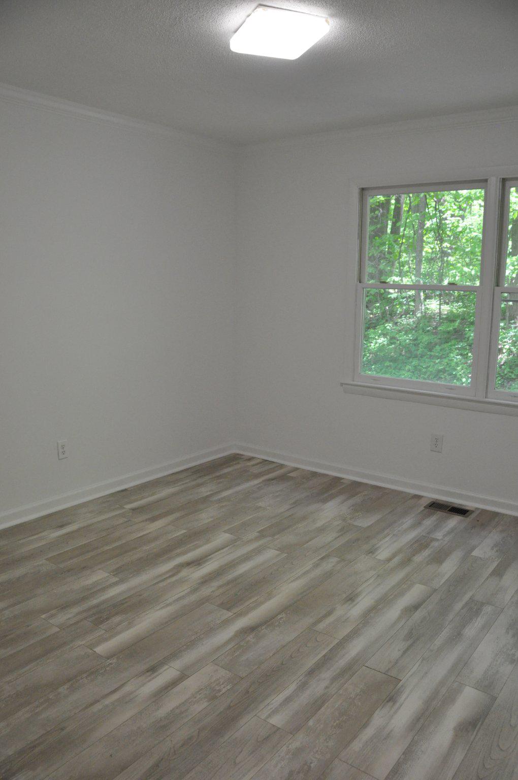 28 Henry Way Linden, VA 22642 - Photo 13 of 39 a view of an empty room with wooden floor and a window