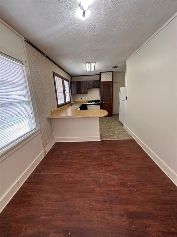 342 Prospect Street Shreveport, LA 71104 - Photo 3 of 8 a view of a kitchen with a sink cabinets and a window