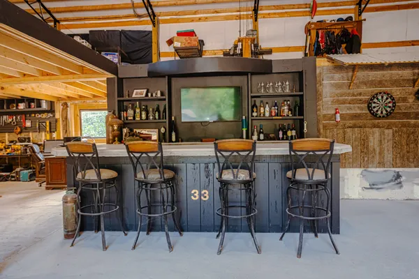 a view of dinning table and chairs in a room