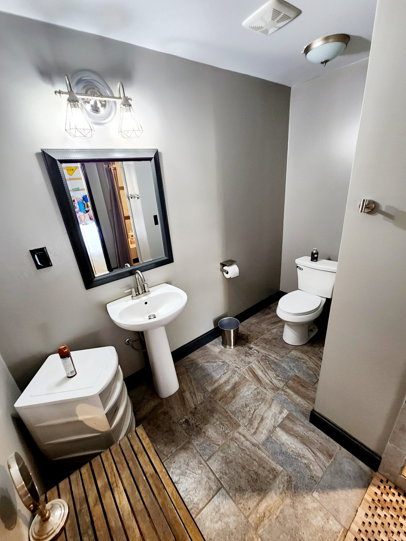 3155 Pigeon Spur Road South Pittsburg, TN 37380 - Photo 36 of 78 a bathroom with a sink a toilet and mirror