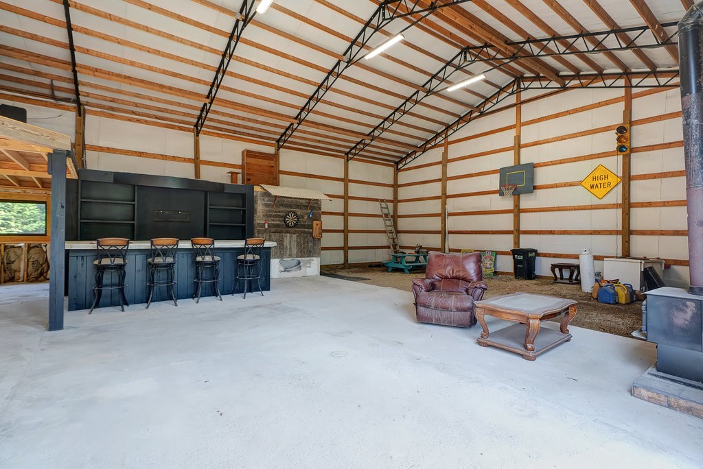 3155 Pigeon Spur Road South Pittsburg, TN 37380 - Photo 63 of 78 a room with furniture and a flat screen tv