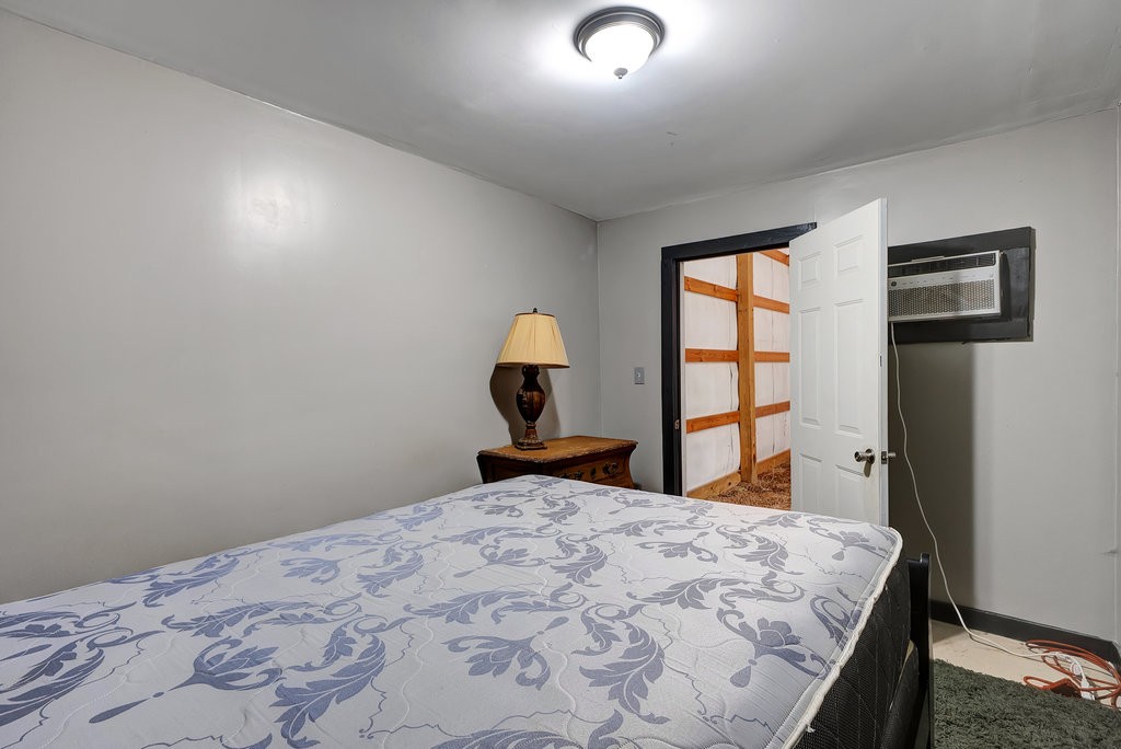 3155 Pigeon Spur Road South Pittsburg, TN 37380 - Photo 66 of 78 a bedroom with a bed and a lamp