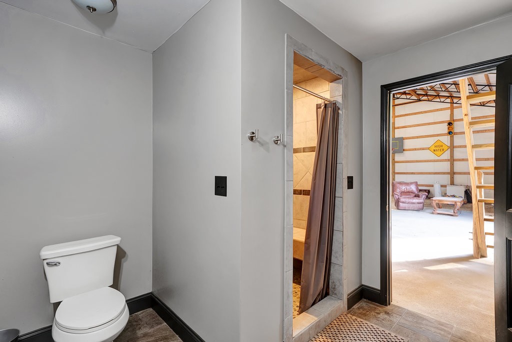 3155 Pigeon Spur Road South Pittsburg, TN 37380 - Photo 68 of 78 a white toilet sitting next to a bathroom sink