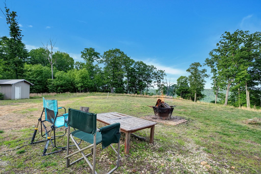 3155 Pigeon Spur Road South Pittsburg, TN 37380 - Photo 74 of 78 a view of a table and chairs in the garden